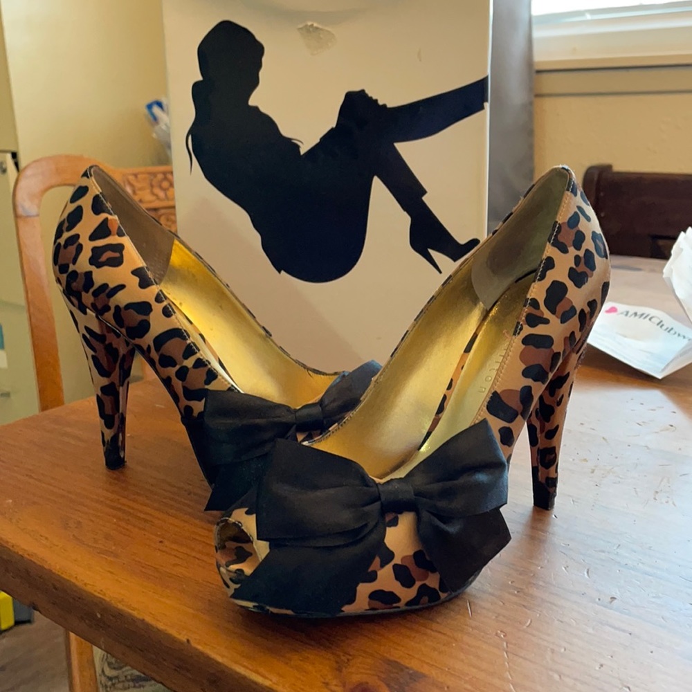 Gently used, leopard slip on heels.